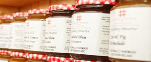 A row of jars of Erin Grove Preserves